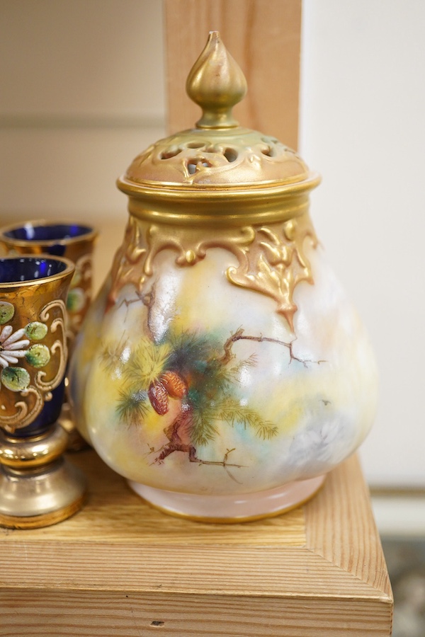 A Royal Worcester peacock painted jar and cover and a Bohemian blue glass decanter and six glasses, with gilt and enamel decoration, decanter 26cm high including stopper. Condition - finial to Worcester pot cover chipped